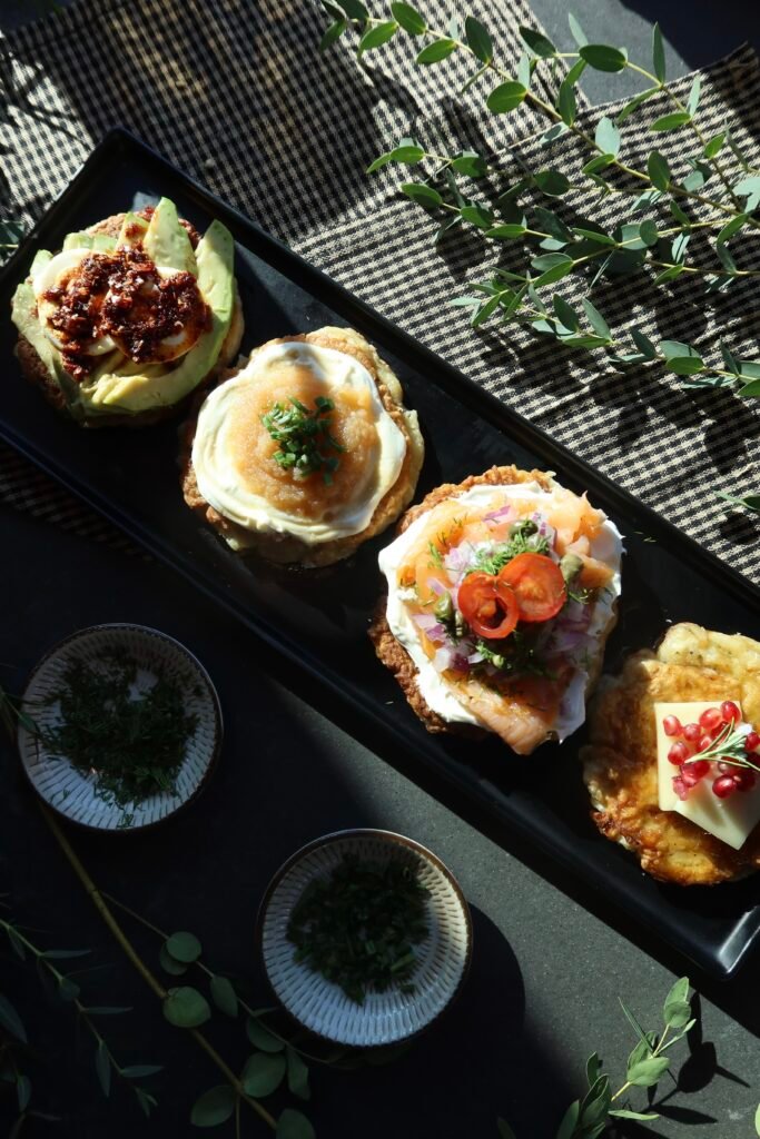 Crispy potato latkes sampler with lox classic breakfast and fromage toppings