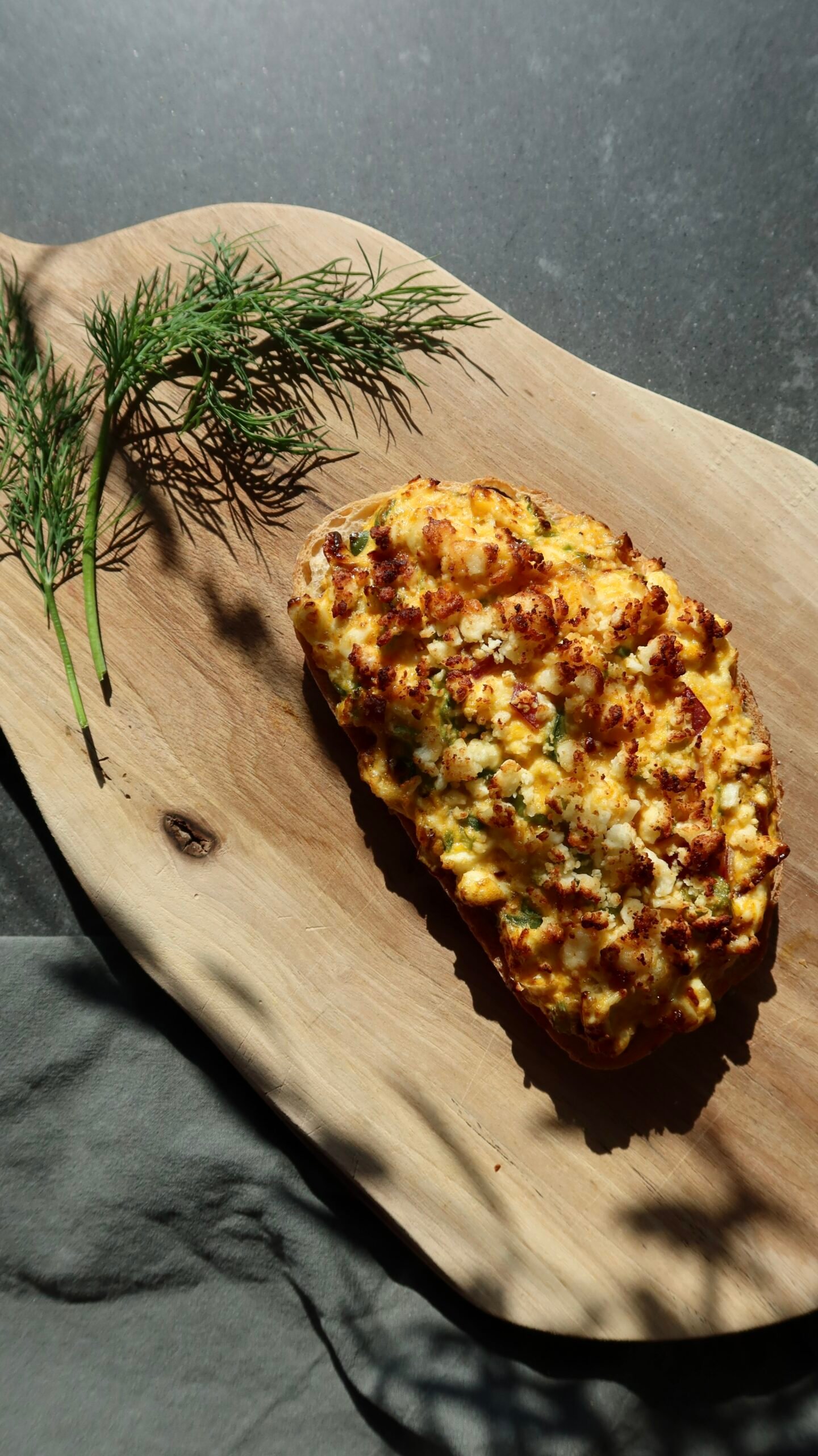 Crispy egg salad open faced toastie with golden feta on sourdough bread high protein oil free