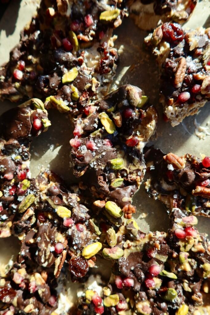 High protein ice cream date bark with cottage cheese nut butter walnuts pistachios pomegranate and dark chocolate