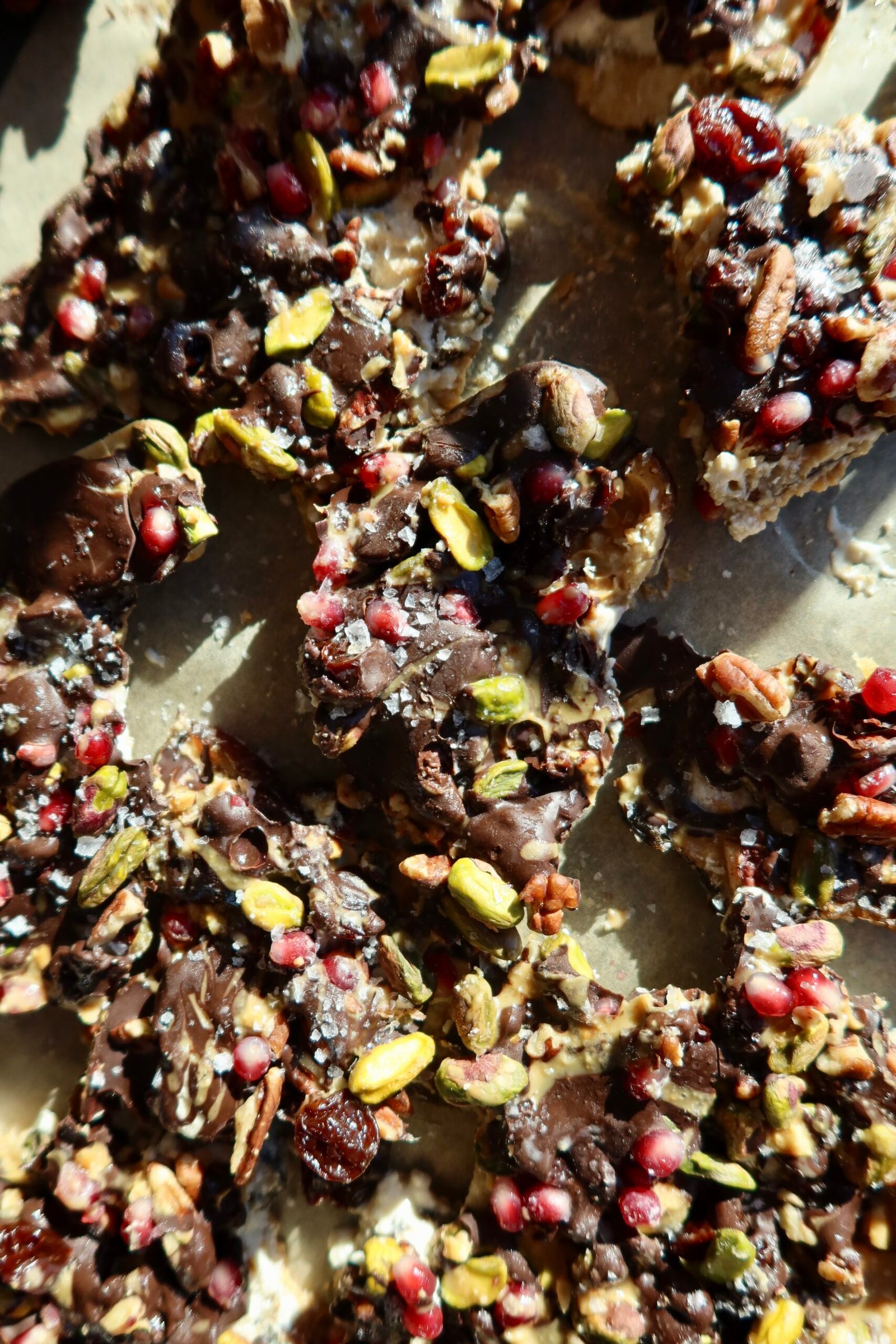 High protein ice cream date bark with cottage cheese nut butter walnuts pistachios pomegranate and dark chocolate