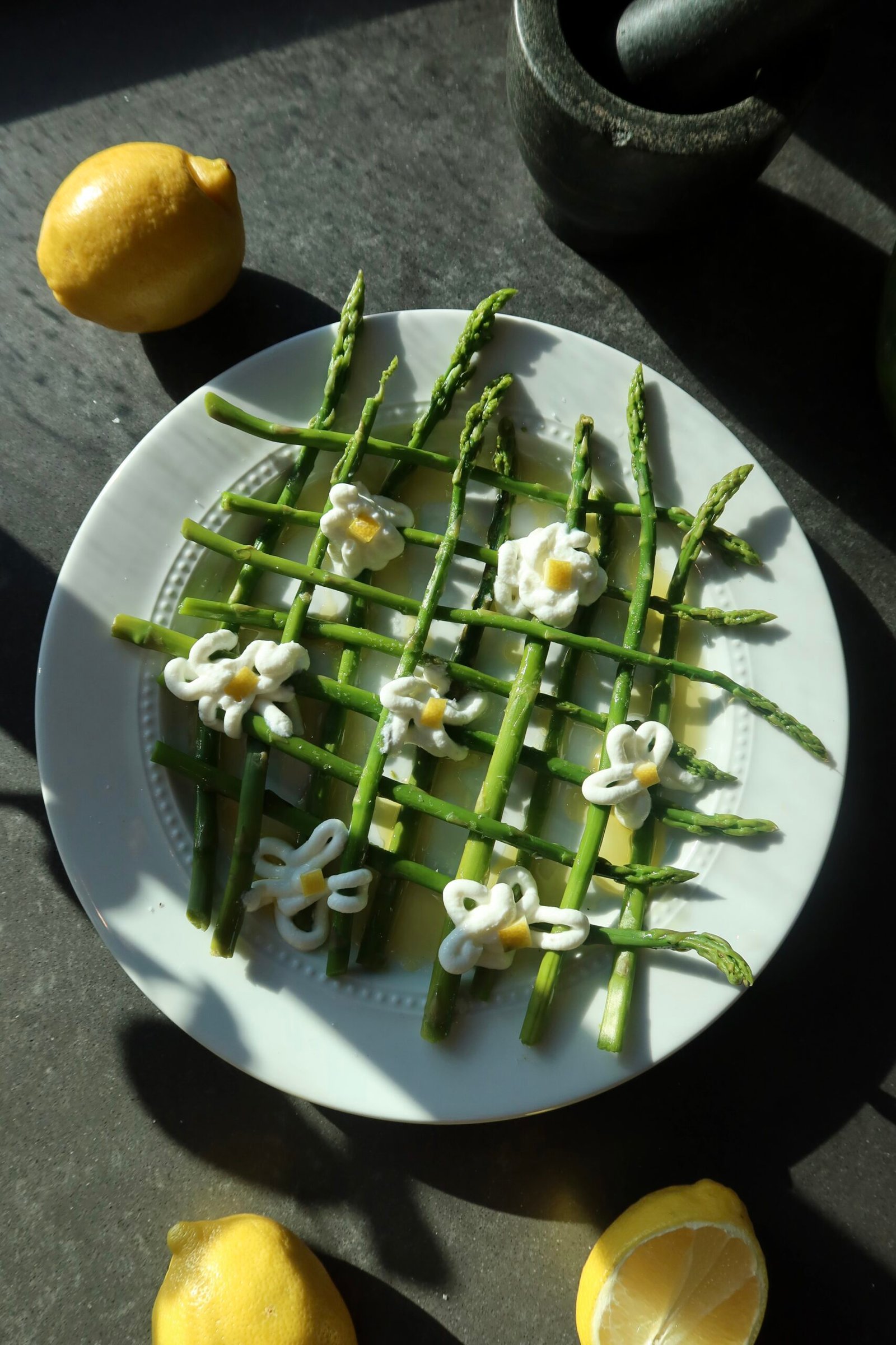Spring asparagus garden plate with whipped yogurt ricotta flowers fresh peas and mint