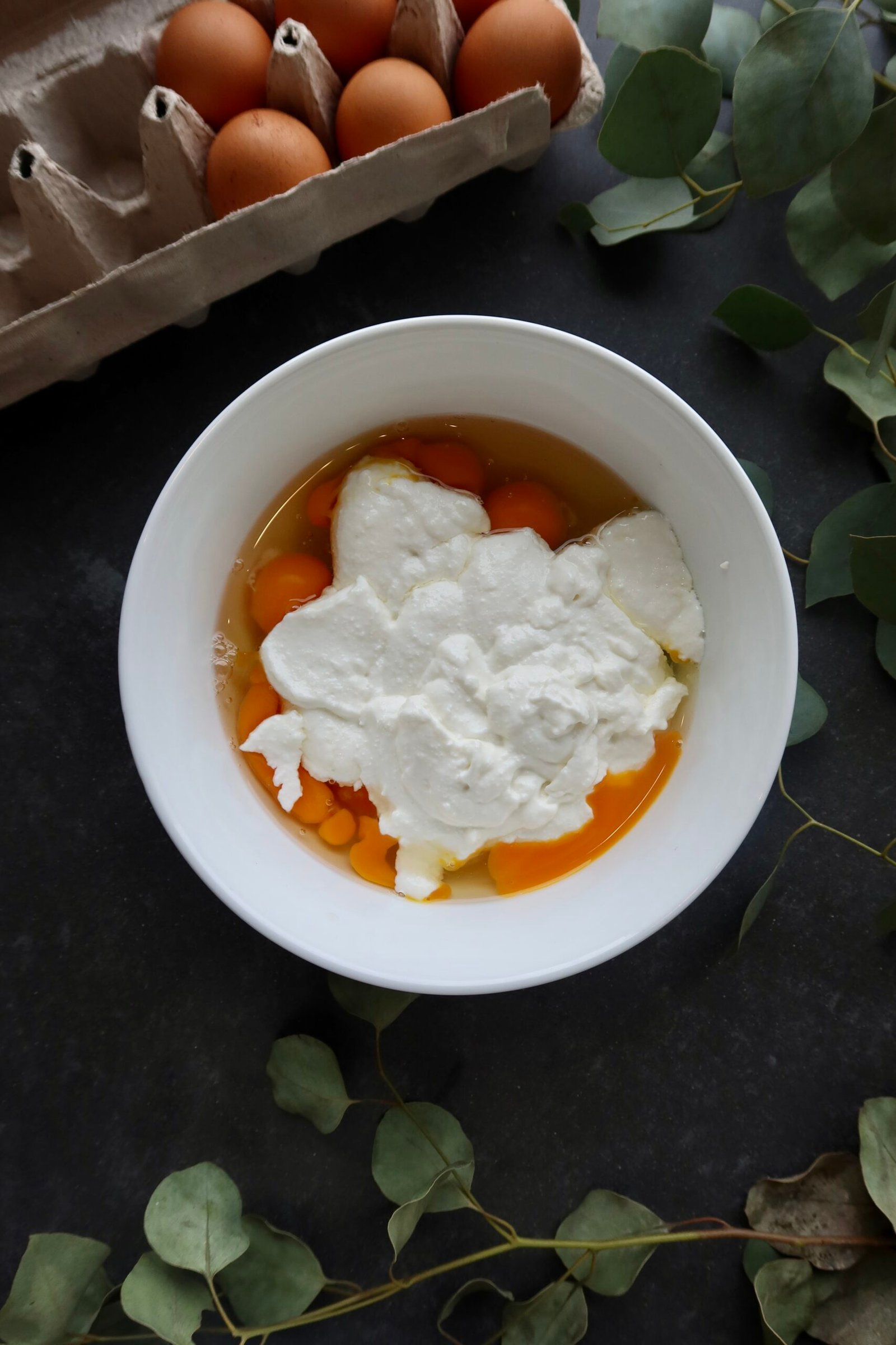 Blended wet ingredients for high protein cottage cheese pancakes including eggs cottage cheese and honey
