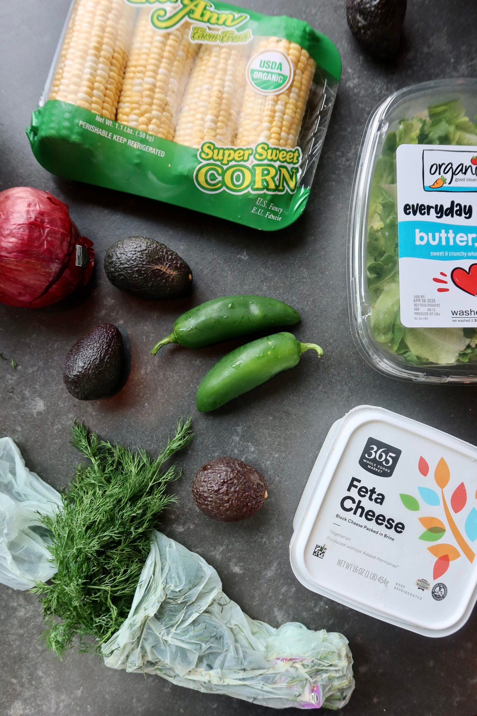 Ingredients for crispy halloumi tacos with zesty corn salad and cilantro avocado sauce
