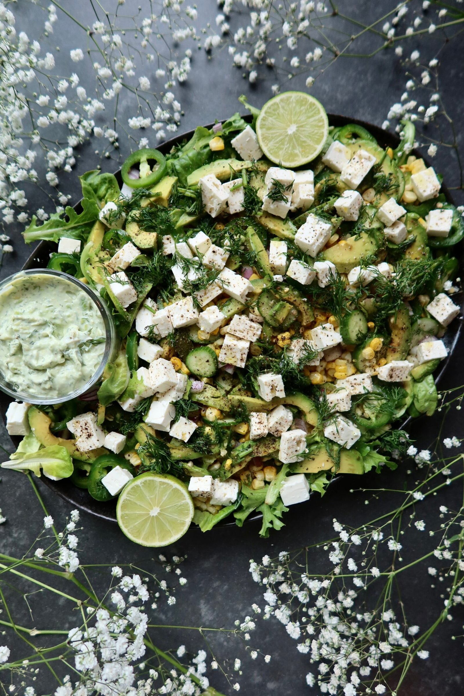 Zesty corn salad with feta cucumber avocado and dill for crispy halloumi tacos