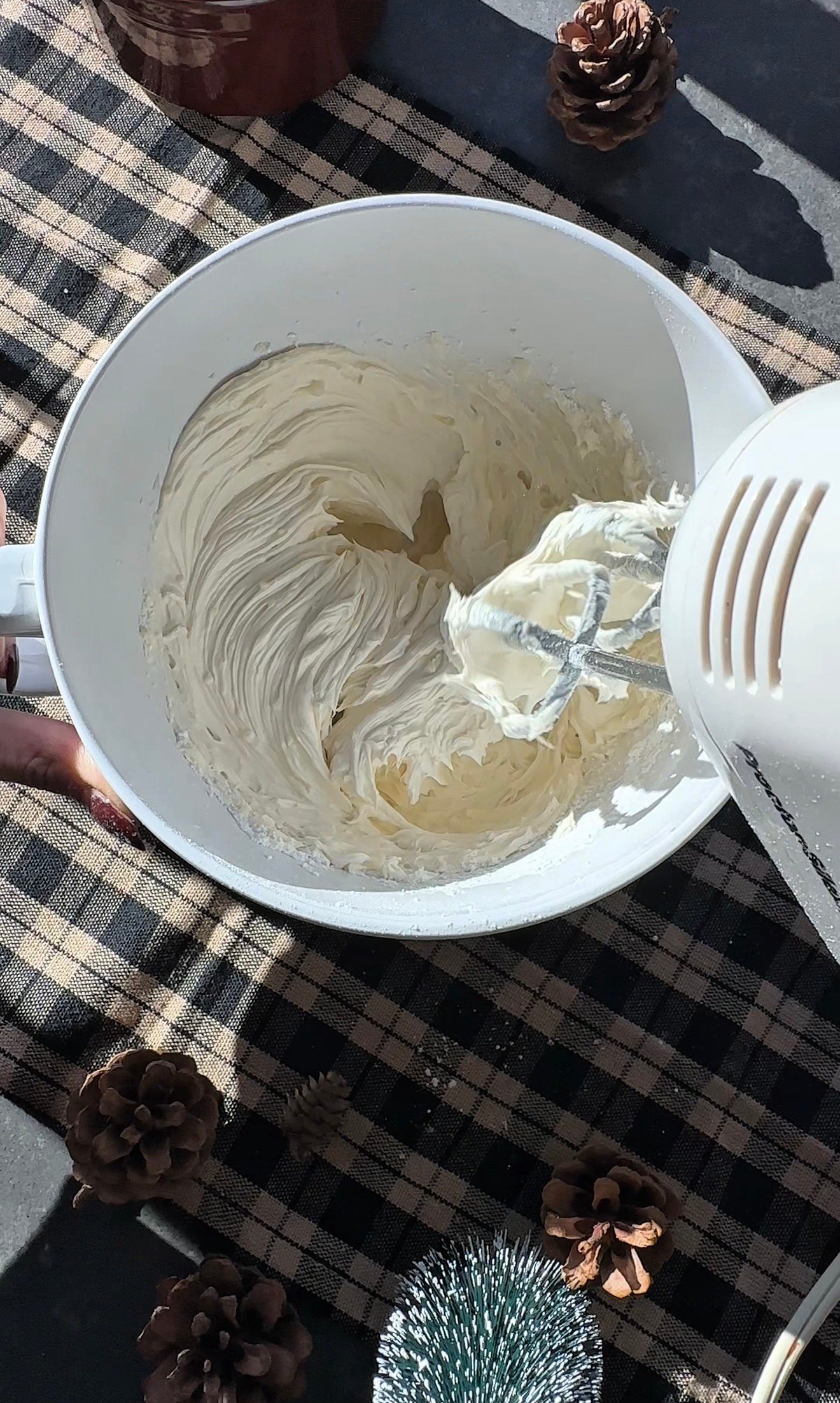 Step 1 of making Christmas cow cookies with wreath collars and cow spot pattern