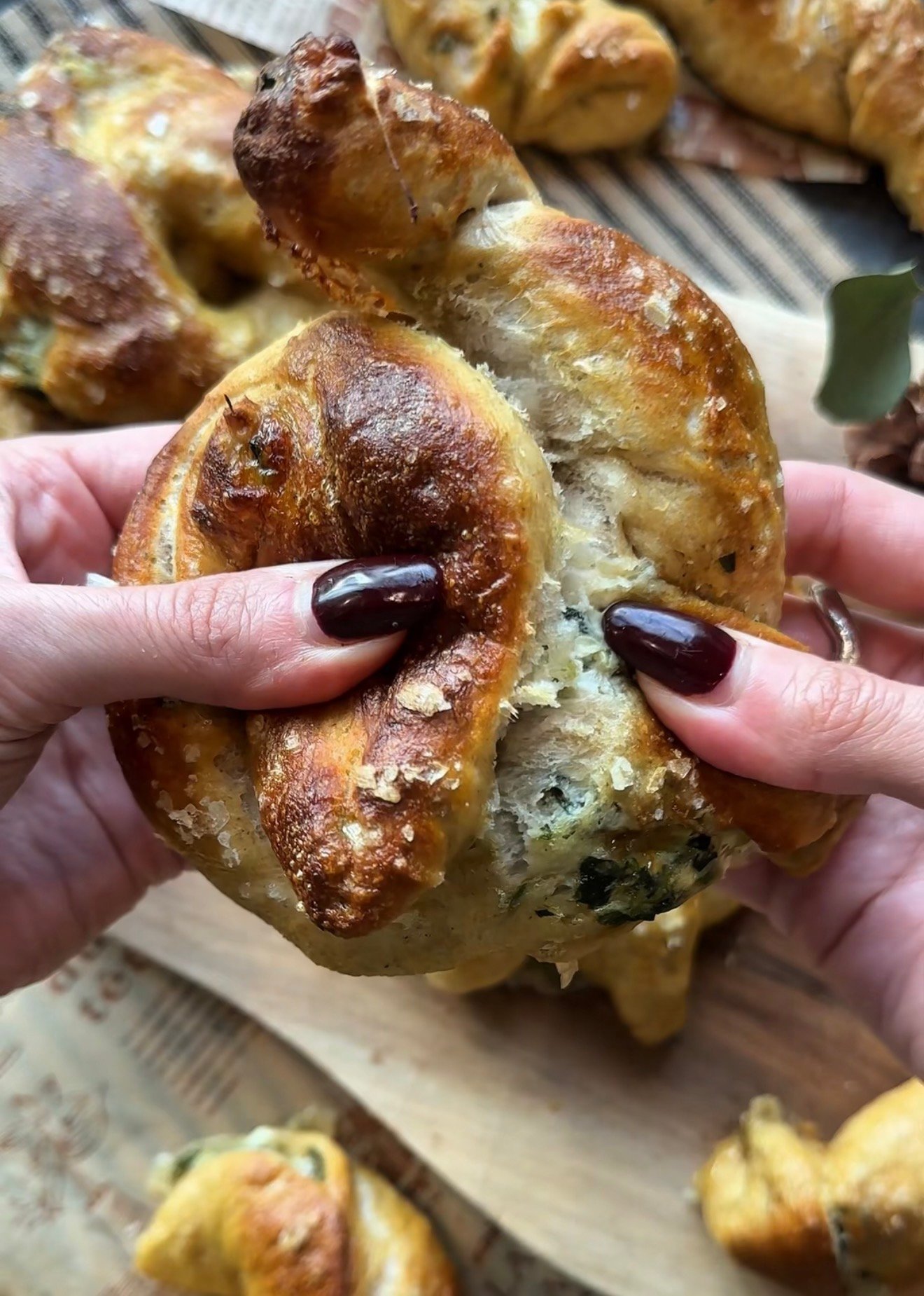 Creamy spinach artichoke filling with cream cheese mozzarella and marinated artichokes for stuffed pretzels