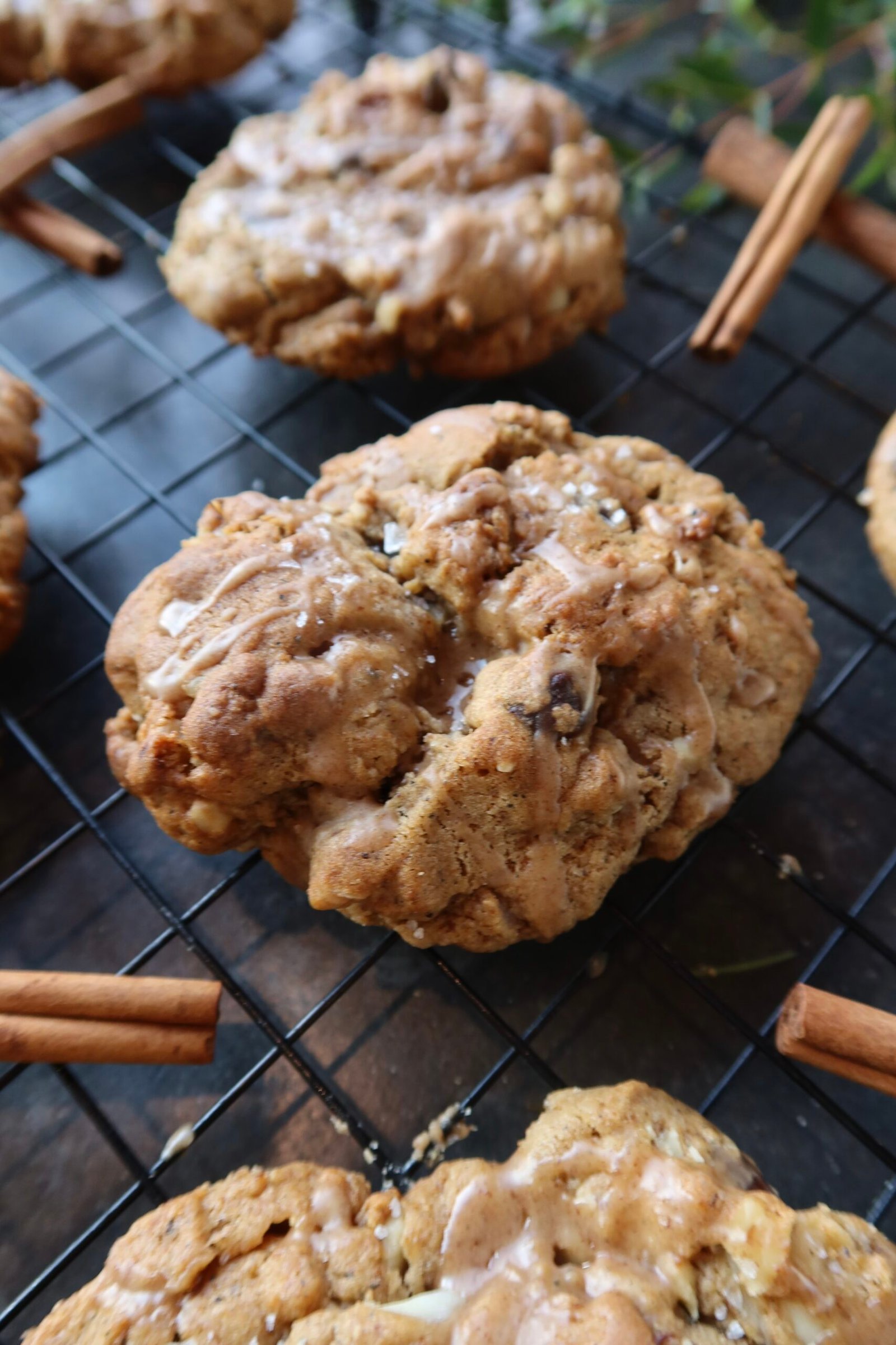 Thick brown butter chai levain cookies with chai glaze crisp edges and gooey centers