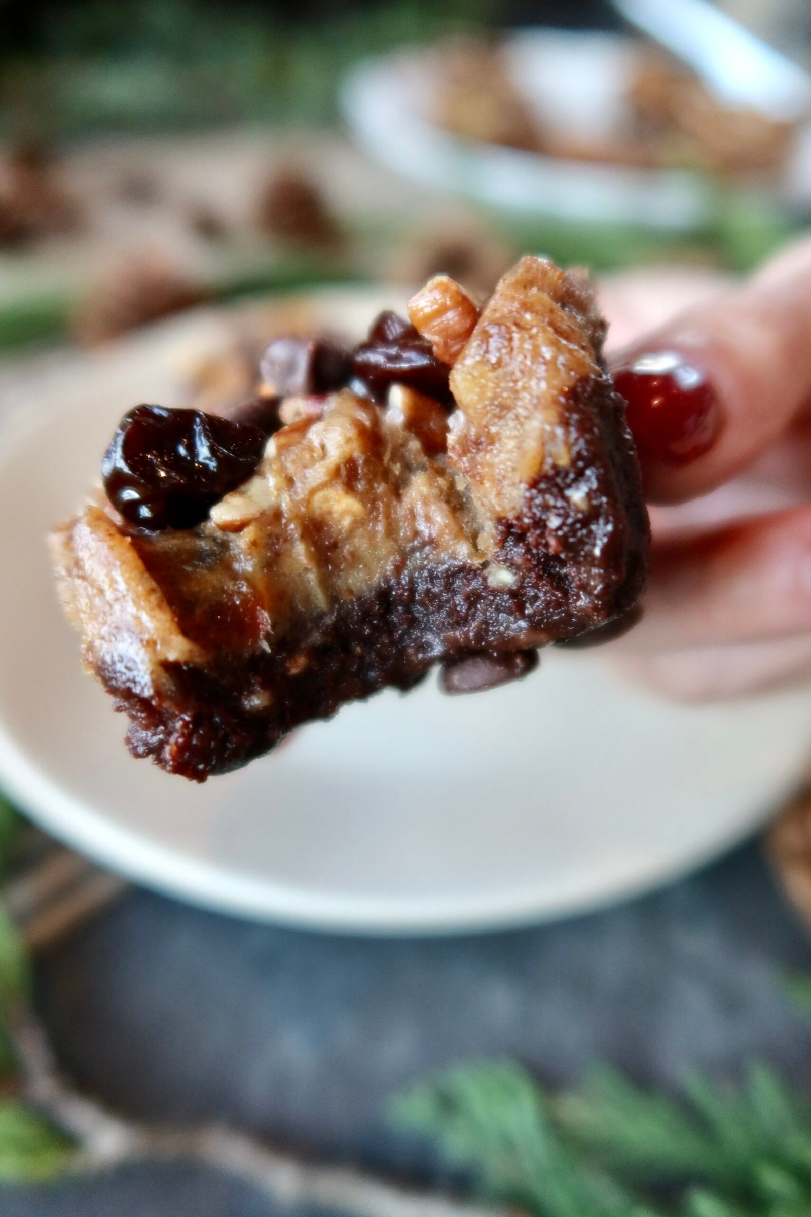 No bake caramel turtle brownie cups with date caramel chopped pecans chocolate chips and flaky sea salt