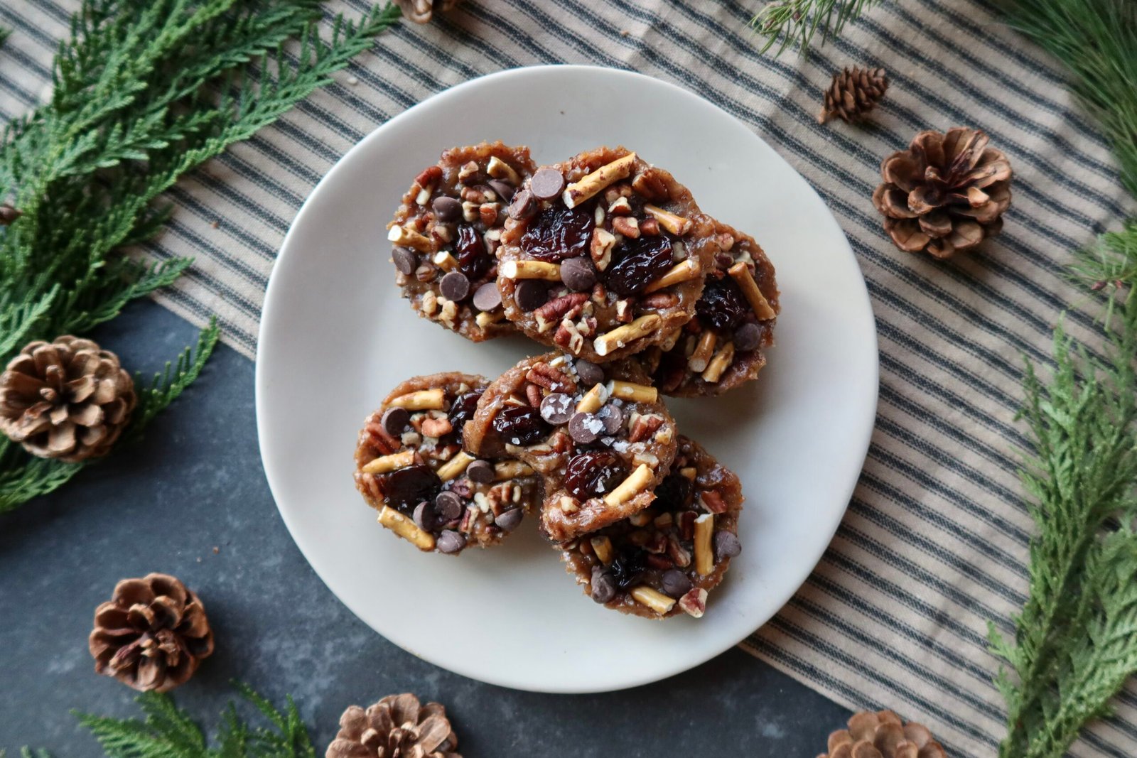 No bake caramel turtle brownie cups with date caramel chopped pecans chocolate chips and flaky sea salt