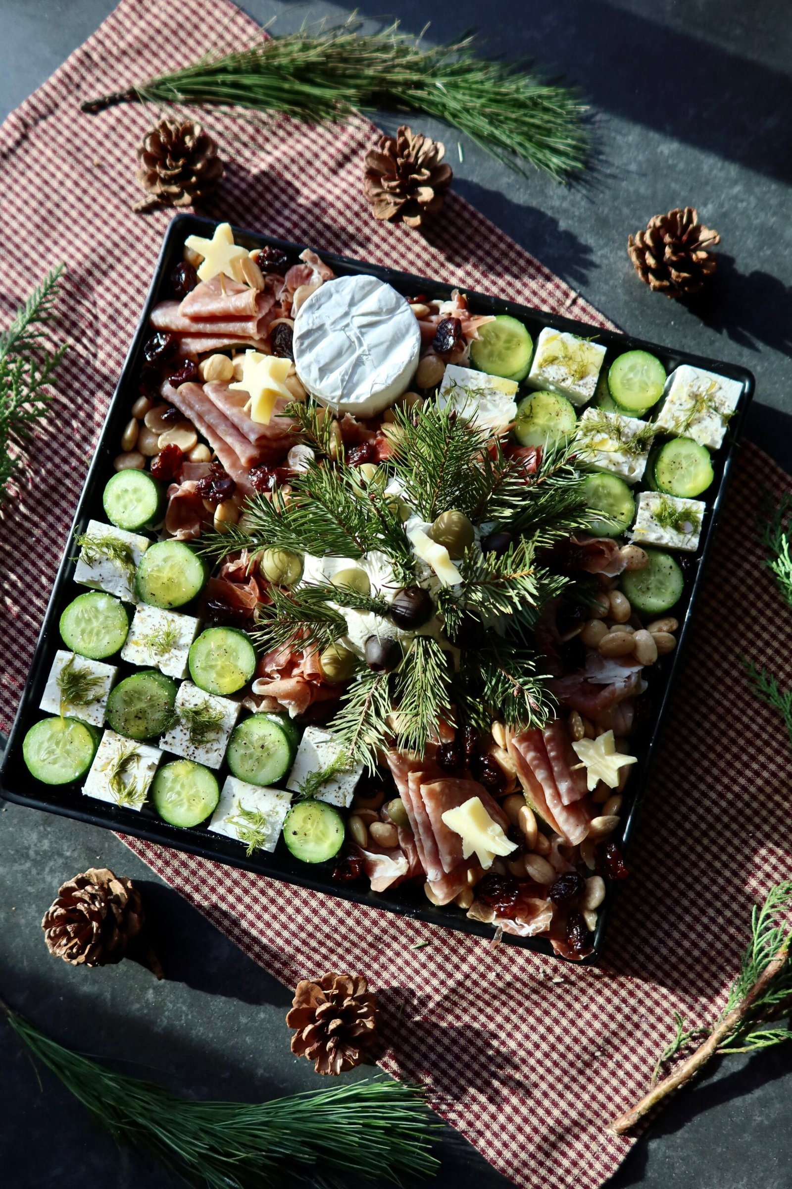 Christmas charcuterie board with Boursin cheese tree feta checkerboard and salami trees