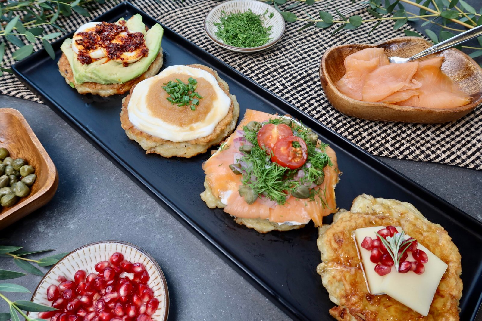 Crispy potato latkes sampler with lox classic breakfast and fromage toppings
