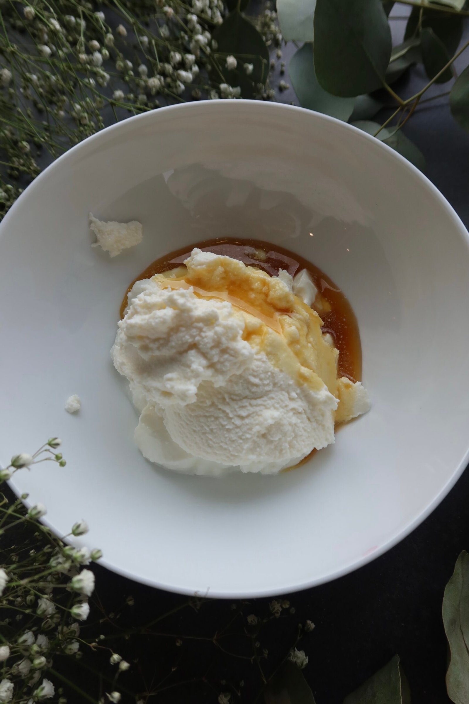 Whipped ricotta yogurt filling in a bowl for high protein almond cherry crepes
