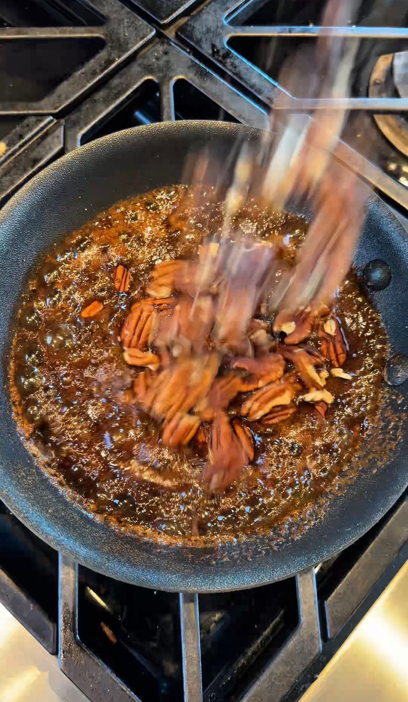 Homemade candied pecans made with coconut sugar cinnamon and cayenne for winter Brussels sprouts salad