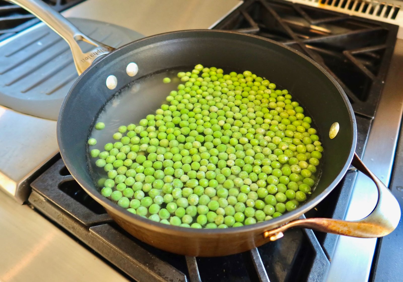 Bright green steamed to go on top of the bright spring salad with roasted fennel