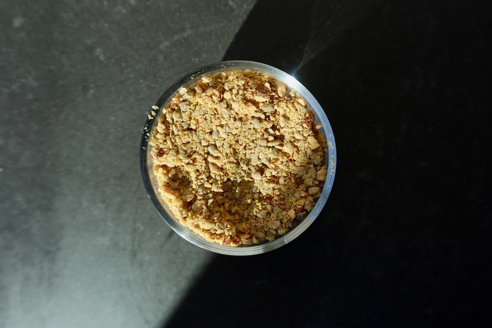 Raw vegan Parmesan sprinkle made with sunflower seeds almonds and nutritional yeast for vegan Caesar salad