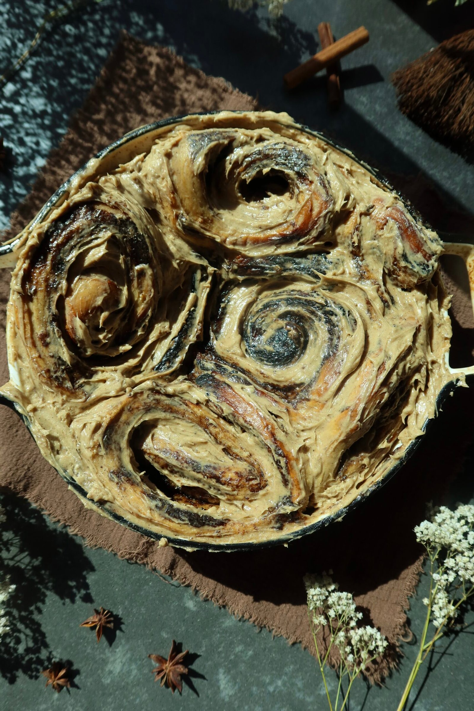 Giant brown butter apple cider cinnamon rolls with gooey apple butter filling and thick cream cheese frosting.