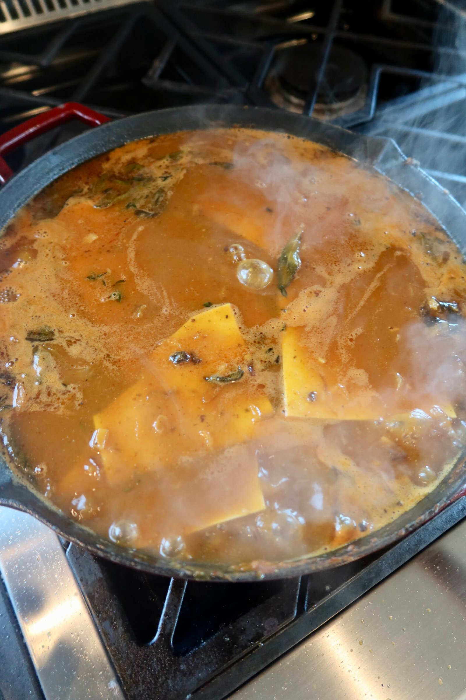 Brown butter pumpkin lasagna soup with Italian chicken sausage, lasagna ribbons, spinach and whipped ricotta.