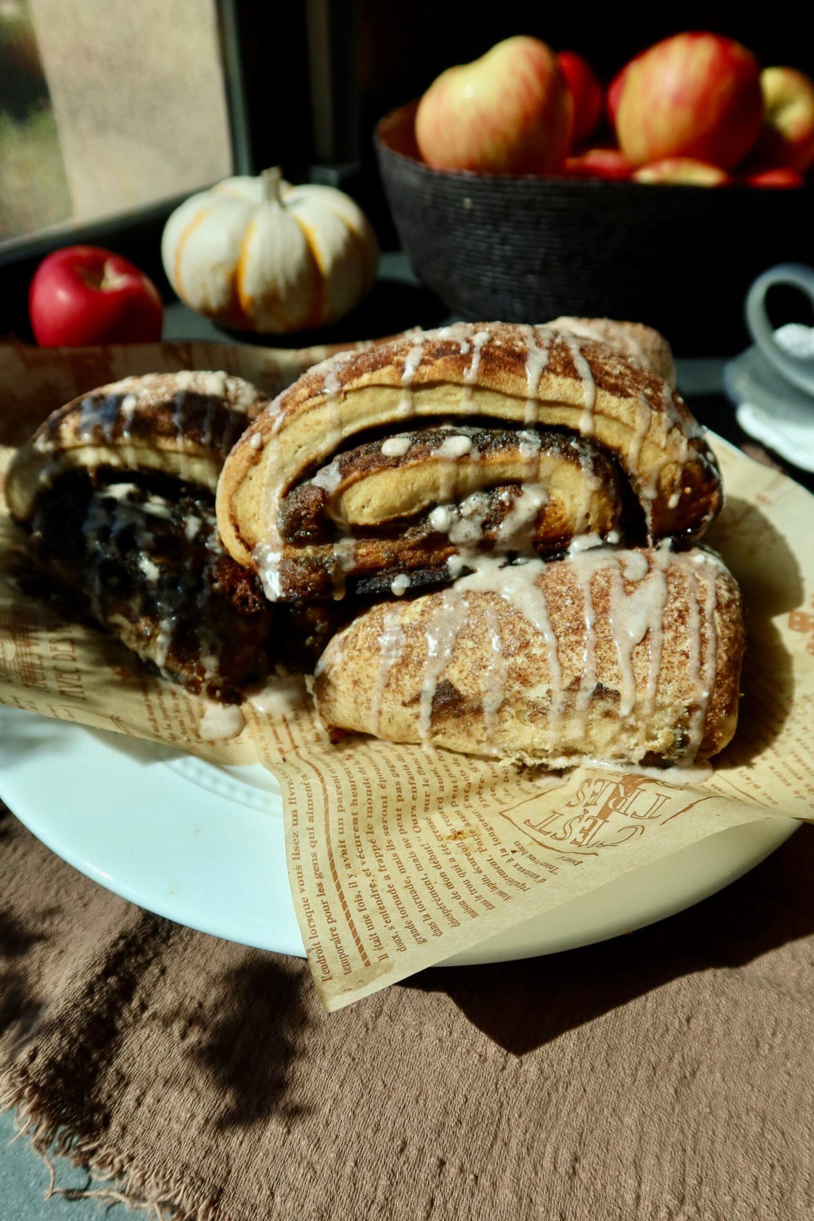 Brown butter apple pie cinnamon roll scones with apple butter filling and maple vanilla glaze