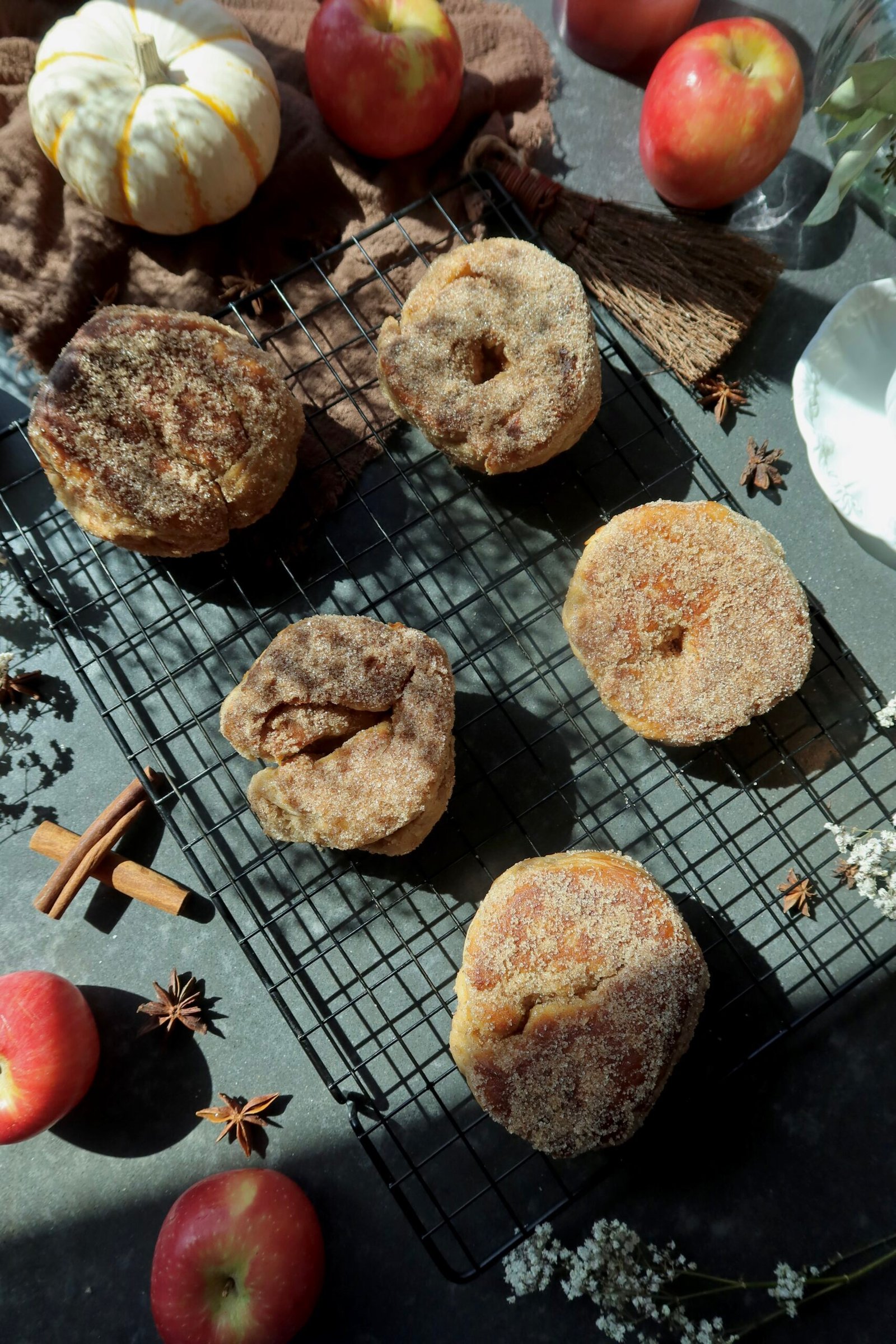 Brown butter chai apple cider donuts coated in cinnamon sugar