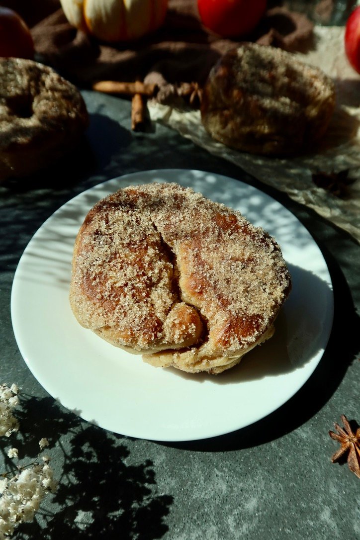 Brown butter chai apple cider donuts coated in cinnamon sugar
