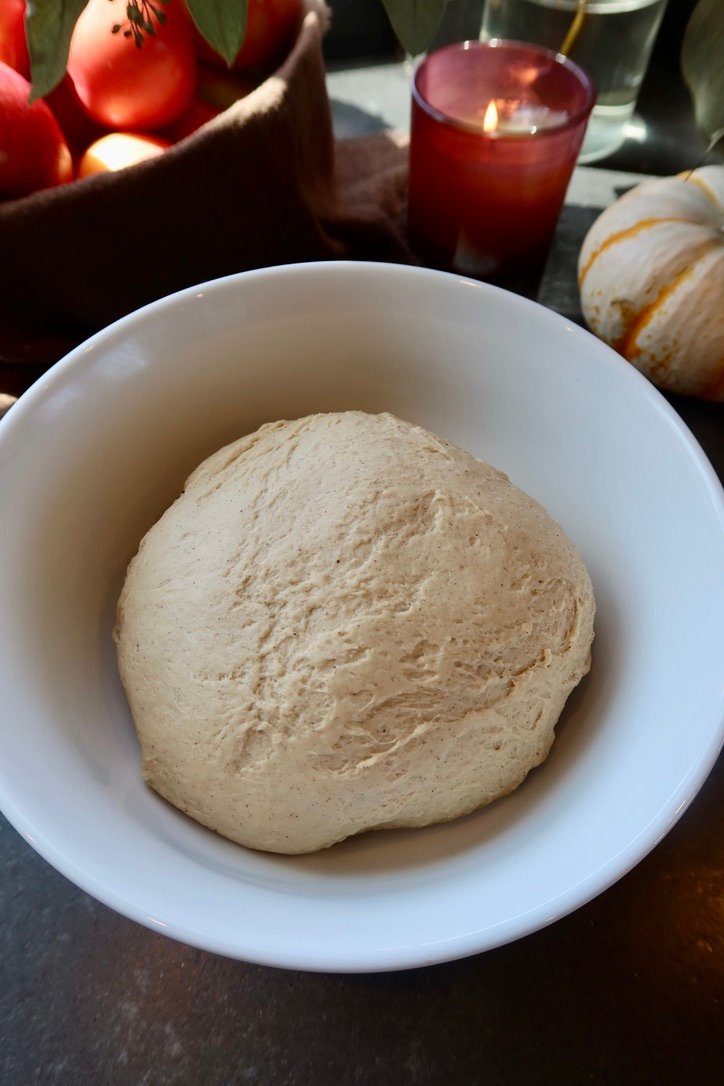 Brown butter chai apple cider donuts coated in cinnamon sugar