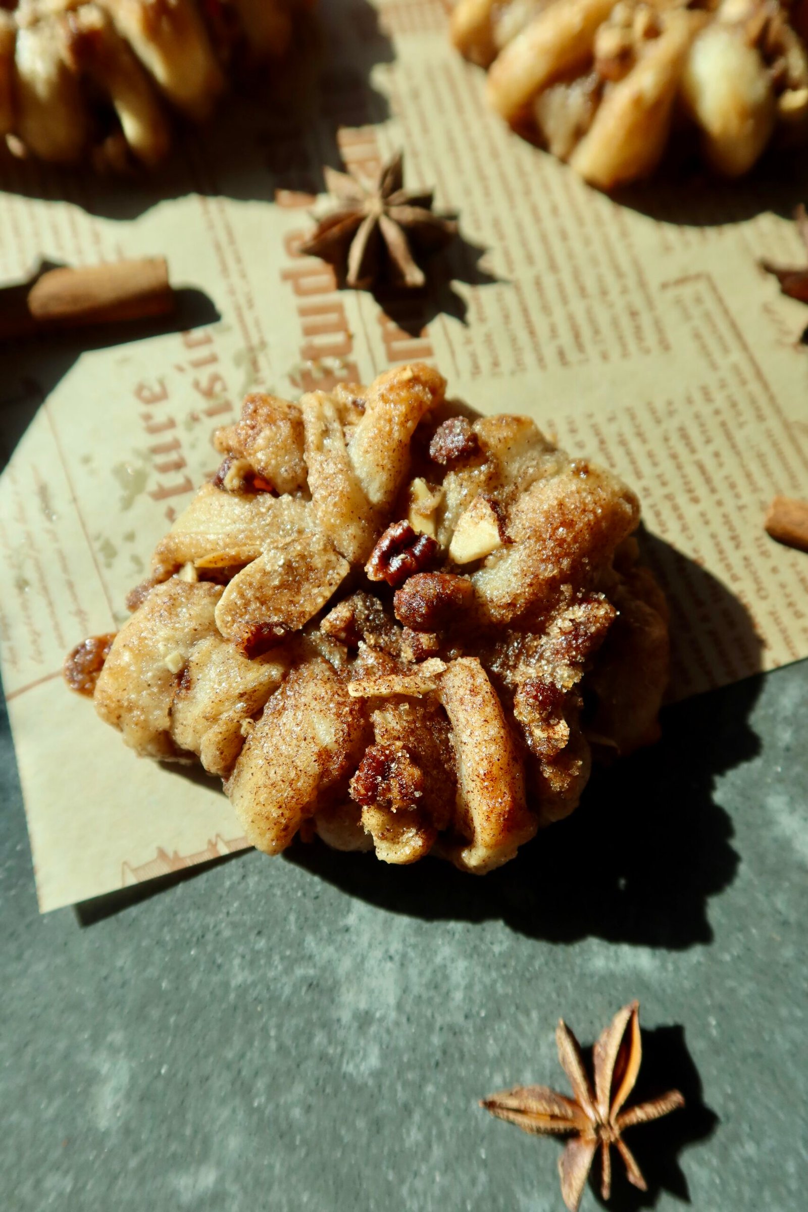 Easy puff pastry apple donuts with cinnamon apples, brown butter pecans and maple vanilla glaze