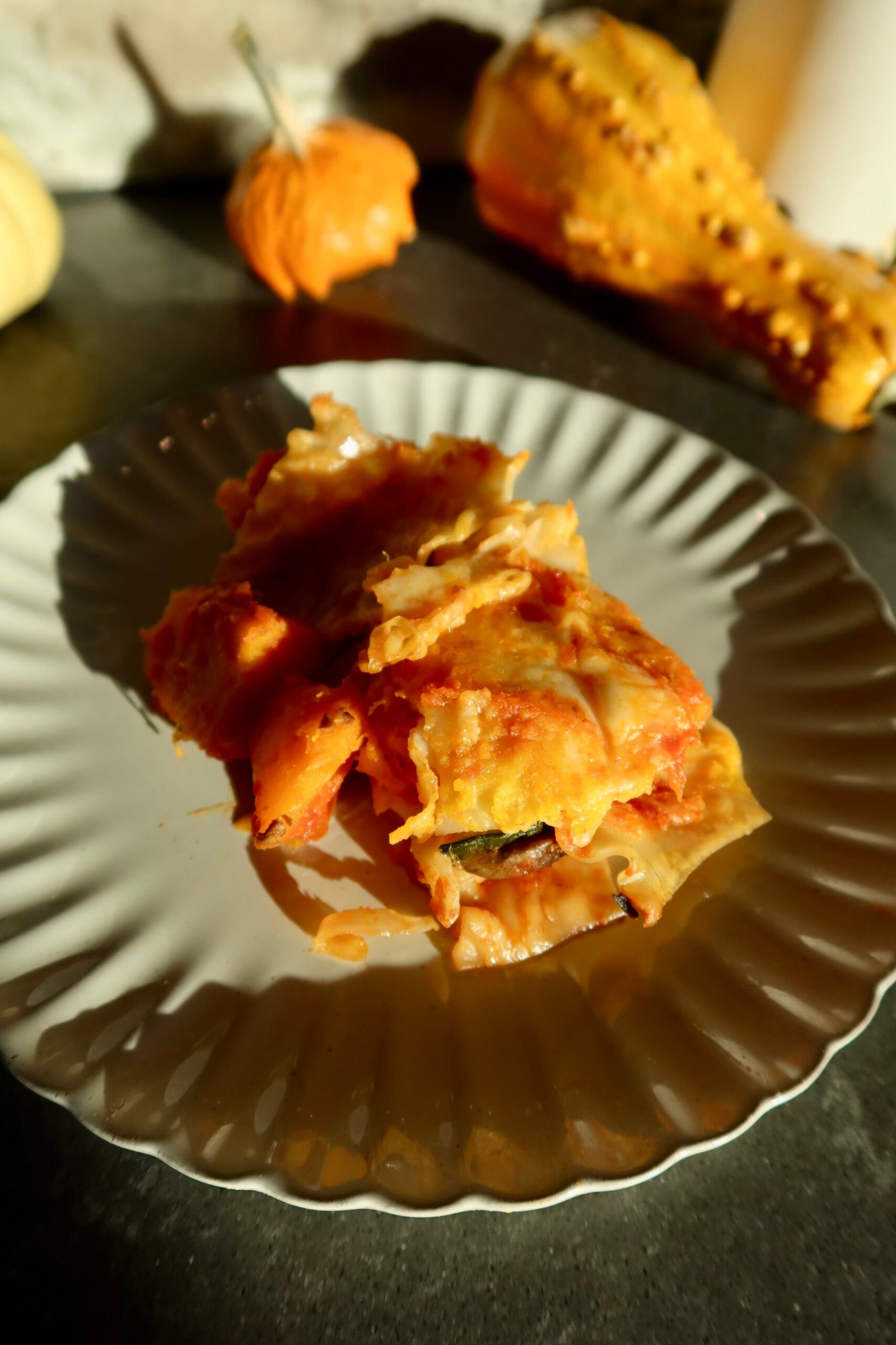 Harvest pumpkin lasagna with zucchini, mushrooms, tomato sauce, and melted cheese