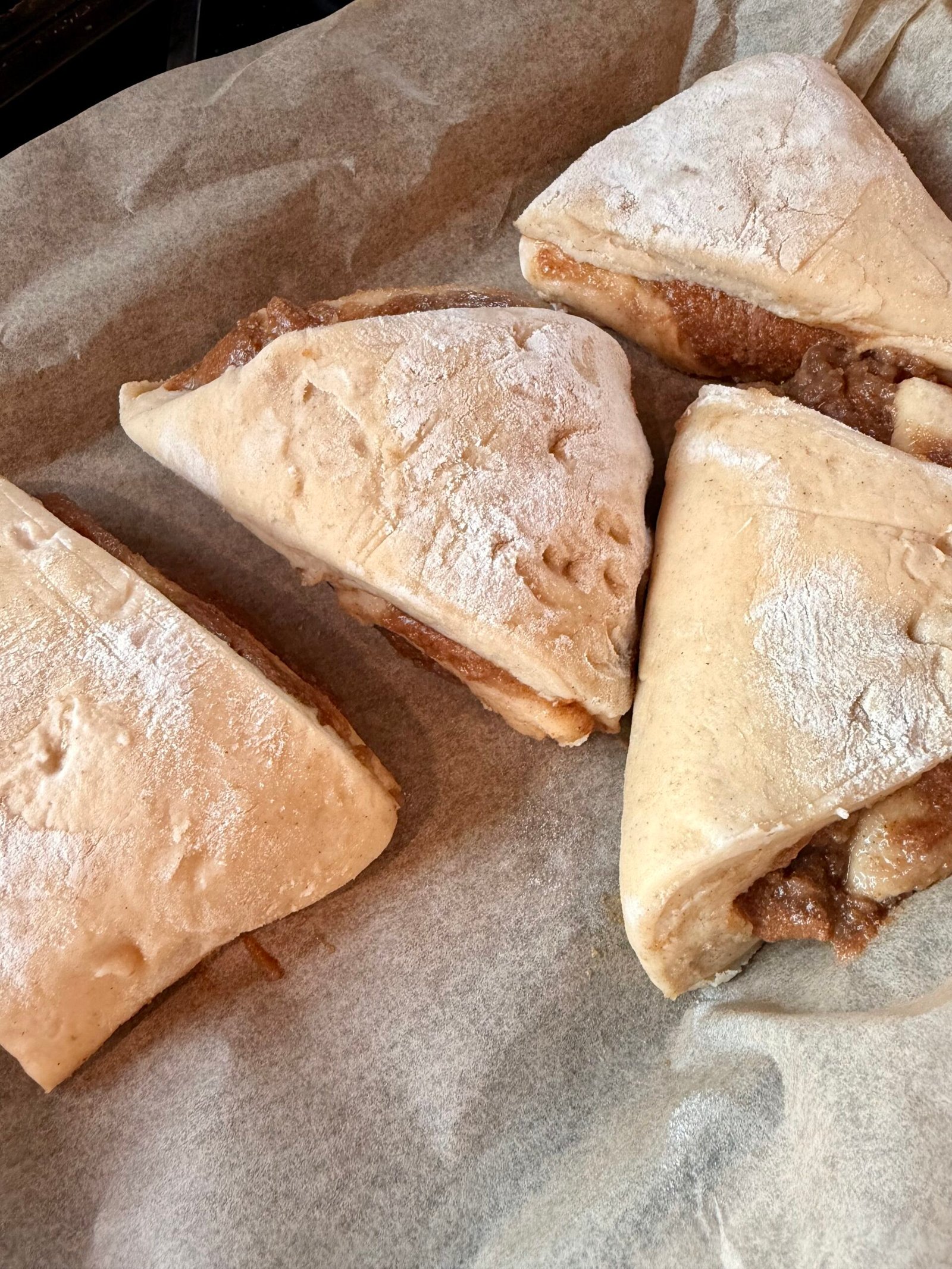 Brown butter apple pie cinnamon roll scones with apple butter filling and maple vanilla glaze